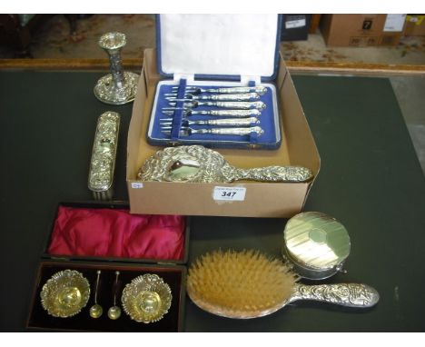 A cased pair of early 20th century silver salts, a part-silver backed dressing table set, a set of six silver handled pickle 