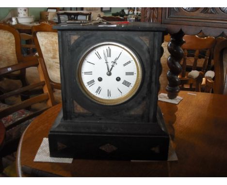 A Victorian slate mantle clock of square form, the enamel dial bearing Roman numerals, 28cm x 32cm.