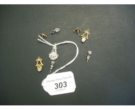 A pair of diamond ear studs, together with a matching pendant, an Art Deco white metal pendant set with various stones and a 