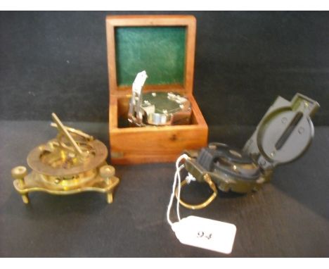 A brass cased compass marked F.L. West, London, together with a Stanley compass in wooden box and another folding modern comp