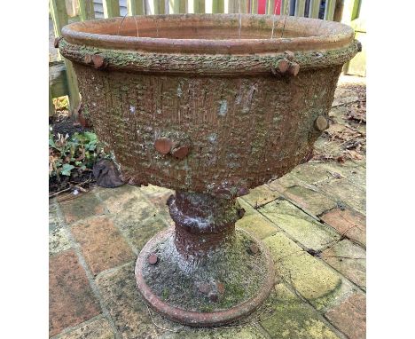 An unusual terracotta circular footed garden planter, having all-over bark form exterior texture, h.56.5cm, dia.50cm 
