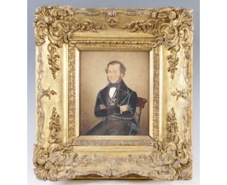 Mid-19th century English school - half-length portrait of a seated gentleman wearing a black tunic, watercolour heightened wi