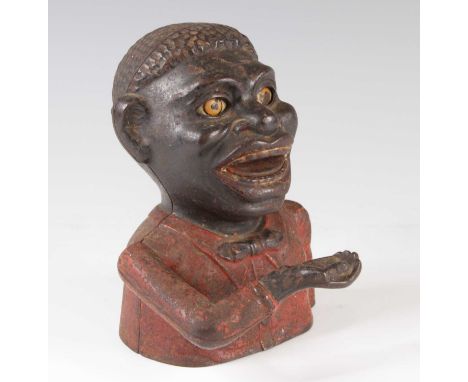 A late 19th century painted cast iron novelty money box, marked verso Made by Shepard Hardware Co. Buffalo N.Y, h.17cm.This i