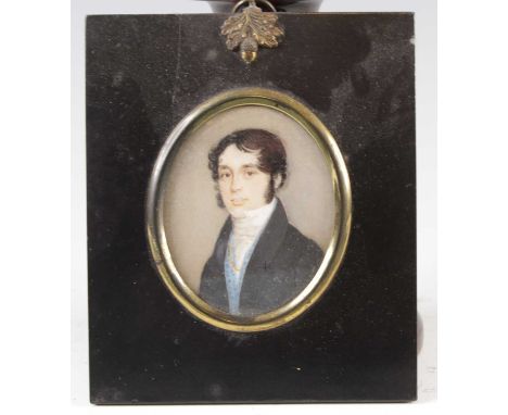 19th century English school - Bust portrait of a young man wearing a pale blue waistcoat and black jacket, miniature watercol