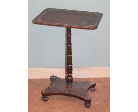 An early Victorian stained mahogany(?) round cornered fixed top pedestal tripod occasional table, raised on quatraform base t