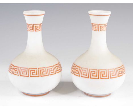 A pair of Victorian milk glass vases, each of squat globular form, red enamel decorated with bands of Greek key, h.19cm Both 