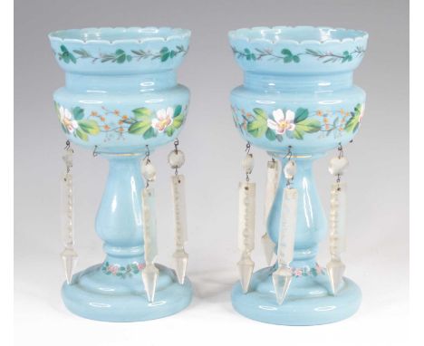 A pair of Victorian blue glass table lustres, each enamel decorated with flowers, having cut glass drops, h.27cmSome missing 