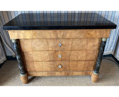 A 19th century Scandinavian satin birch commode, of four long graduated drawers, having an ebonised top surface, simulated ma