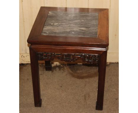 A circa 1900 Chinese 'rosewood' and grey variegated marble inset square urn stand, having carved and pierced frieze, h.53.5cm