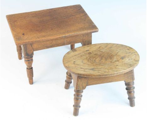 A 19th century provincial small stool / candle stand, the oval oval top above a plain frieze on four turned supports, w.23.5,