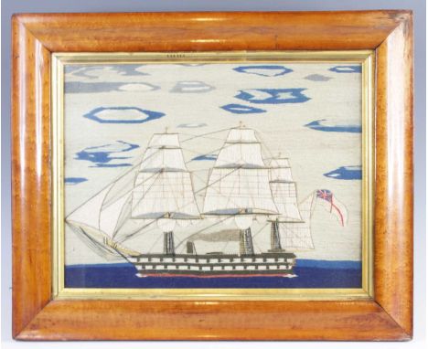 A mid-19th century sailor's woolwork depicting a three-masted frigate flying the British naval ensign, 28 x 36.5cmColours goo
