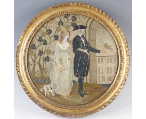 An early 19th century embroidered and woolwork panel depicting a courting couple, their heads being pastel painted on paper, 