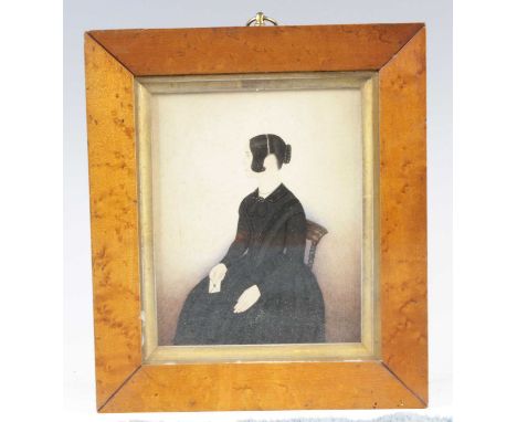 An early Victorian three-quarter length portrait silhouette of a young woman in seated pose, watercolour, 14 x 11.5cm, in pro
