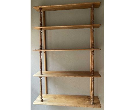 A Victorian pine round cornered five-tier waterfall open wall shelf, with turned columns, h.94cm, w.64.5cm, d.18.5cmShelf gap