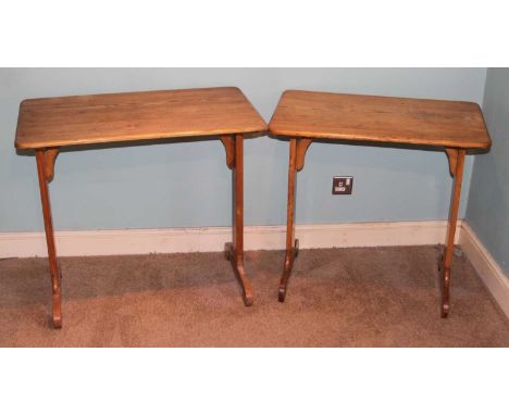 A near-pair of Victorian light oak round cornered side tables, raised on end cut supports, each h.75cm, w.83cm, d.49.5cm