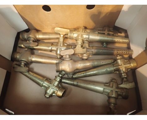 Ten single brass vintage beer taps