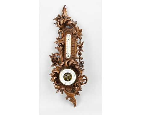 Antique carved rococo barometer of walnut, with rocailles. Circa 1900. Size: 73 cm. In good condition.