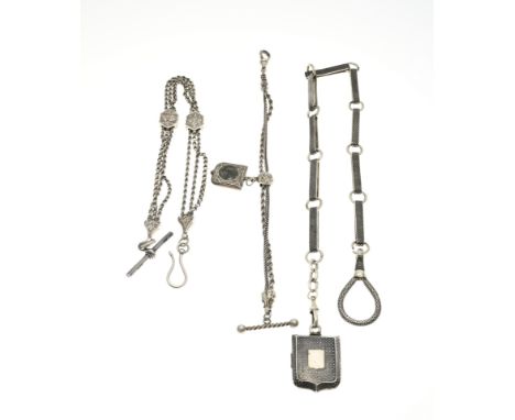 Three silver watch chains, a model with rectangular links, a trouser hook and a medallion pendant all decorated with niello, 