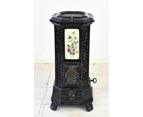 Antique cast iron stove with enamelled floral plaques. Circa 1900. Only breakage in top grate. Dimensions: 80 x36 x 35 cm. Ot