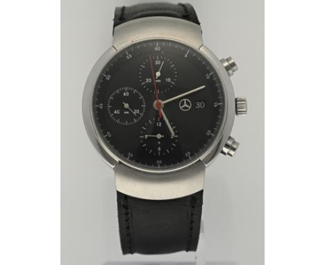 Mercedes Benz design watch, with a steel case. Chronograph, black dial and date display. Automatic. Equipped with a glass bac