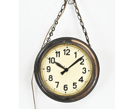 Antique double-sided station clock made of copper. Electric. Circa 1920. Dimensions: Ø 40 x 19 cm. Not tested. In good condit
