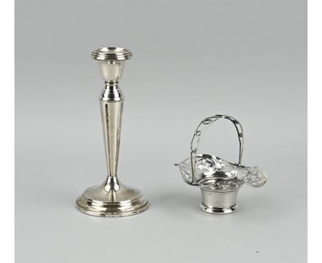 Silver candlestick, 835/000, and a small bonbon basket, 925/000. Candlestick on a round base with a conical pillar and fillet
