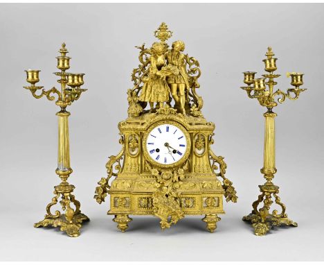 Three-piece 19th century French gilt bronze clock set with candlesticks. Romantic couple with fruit. Eight-day movement, half