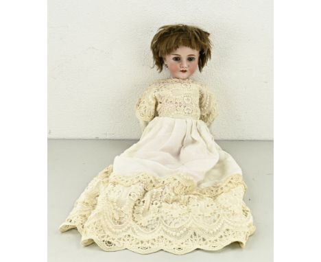 Antique German porcelain doll. Circa 1920. K + H Walkine 250, 5 1/4, with sleep eyes, jointed body and real hair. Size: 65 cm