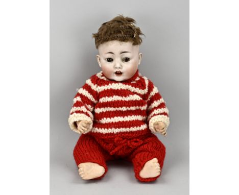 Antique porcelain character doll. Circa 1920. Marked no. 36, 99/6, Made in Germany. With real hair, baby body and sleep eyes.