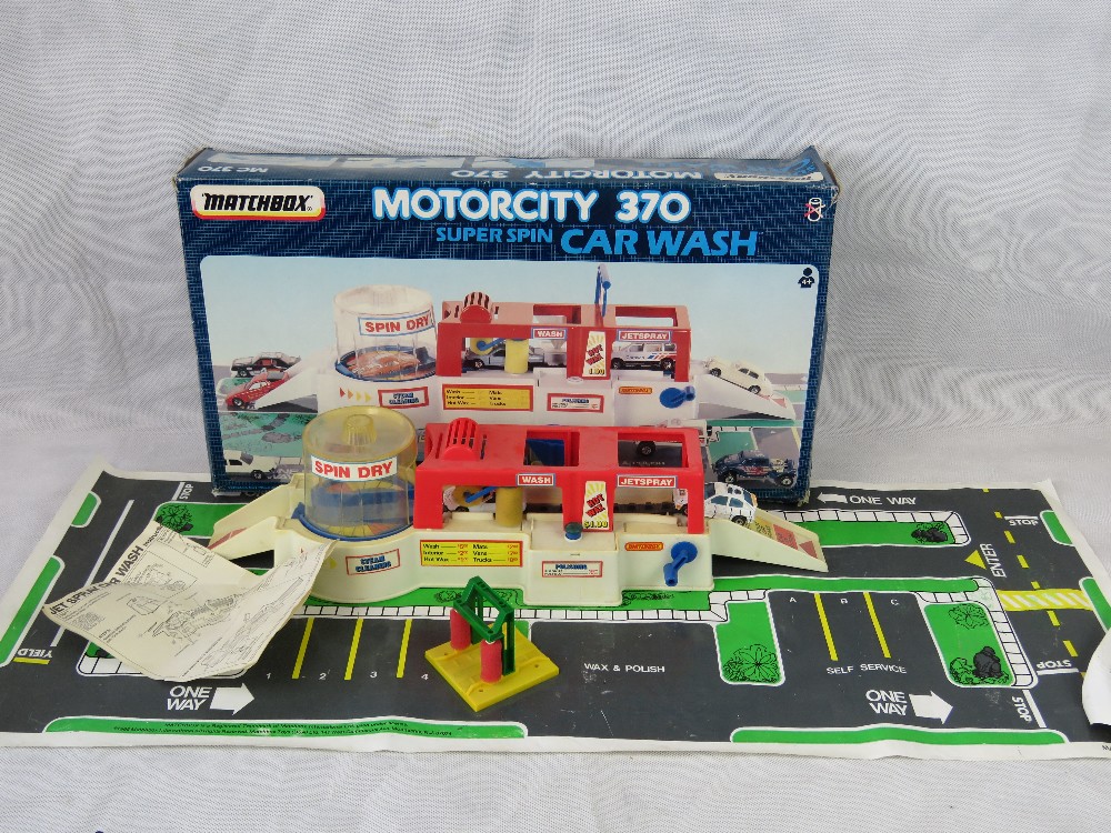 A retro Matchbox Motor city 370 super spin car wash with some