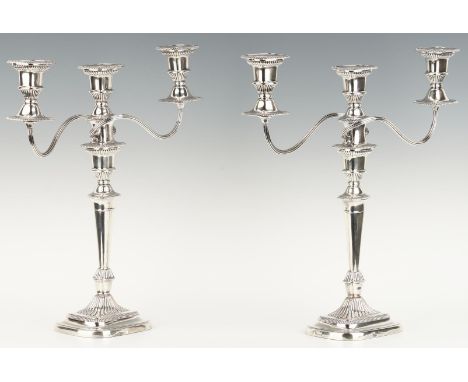 Pair large Neoclassical style 3-light candelabra with reeded arms supporting rectangular, gadroon-edge candle cups and issuin