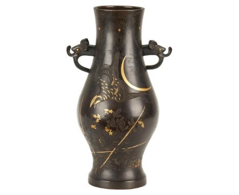 Japanese or Chinese inlaid bronze vase, baluster form with figural elephant head mask handles. Silver line inlay to neck and 