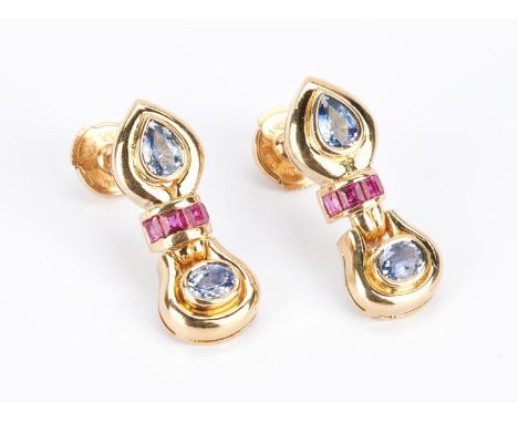 1 pair of 18K yellow gold earrings by designer Mecan Elde featuring 4 sapphires (2 oval, 2 pear) weighing 1.44 carats and 8 s