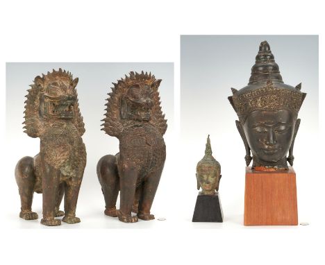 Four (4) Asian Bronze items, including Temple Dogs and Buddha heads. 1st &amp; 2nd items: Pair of Southeast Asian patinated b