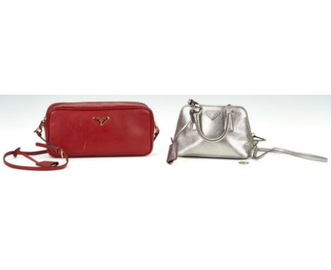 Two (2) Prada purses, including Mini Promenade chromo-silver, red saffiano lux leather bag. 1st item: Mini Promenade chromo-s