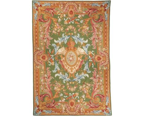 20th century room size wool on cotton Aubusson style needlepoint carpet with central floral cartouche design on an emerald gr