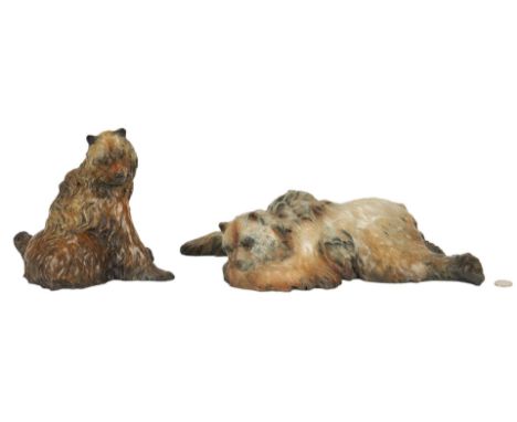 Pair of Jerry McKellar (Washington, b. 1944) bronze bear sculptures. 1st item: Patinated bronze sculpture depicting a sleepin