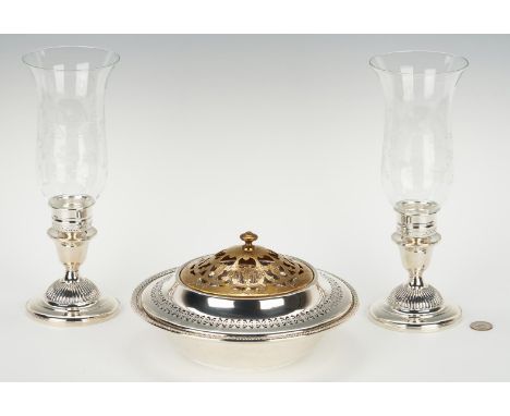 Grouping of 4 sterling silver items, including bowls, flower frog, and candlesticks. 1st item: Circular pedestal bowl with pi