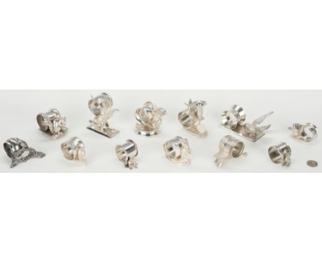 An assortment of twelve (12) silverplated napkin rings with figural animals including eagles, dog, butterfly, frog, owl, squi