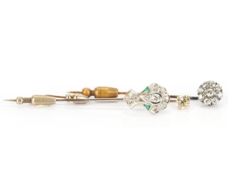 3 gold and diamond pins, 2 14K and 1 18K. 1st item: Ladies 18K white gold pin featuring 1 round brilliant diamond approximate