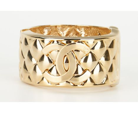 Vintage Chanel Quilted Logo goldtone bangle bracelet, quilted ground with raised double "C" Chanel logo to each side. 6 1/4" 