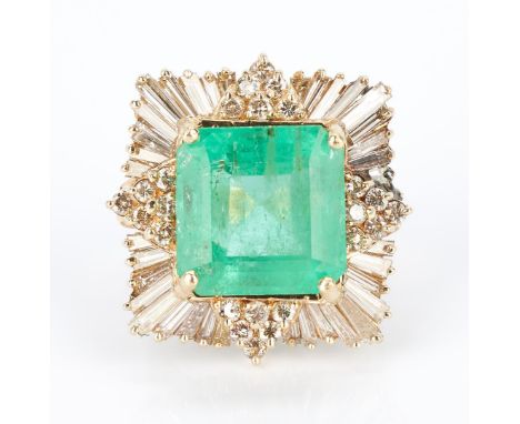 Ladies 14K yellow gold ring featuring one emerald cut natural emerald approximately 13.17 carats (14.49 x 14.31 x 9.17mm), in