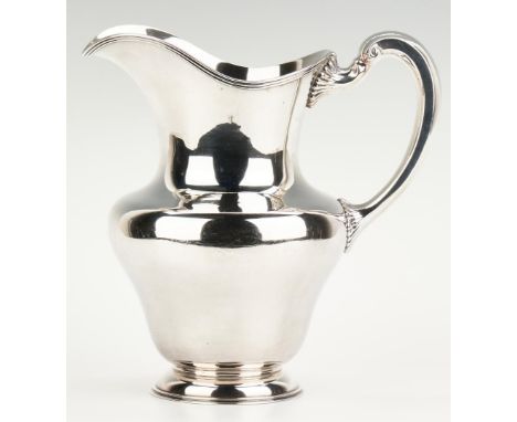 Large and heavy Towle sterling silver water pitcher, bulbous body with molded rim and C scroll handle having gadrooned termin