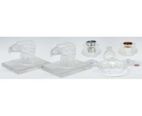 Six (6) pieces of Lalique (French, founded 1888) art glass, including: a three-piece Lion's Head smoke set (lighter, candle h