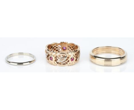 Grouping of three (3) wedding bands. 1st item: One ladies 14k white gold 1.8mm wedding band. Marked "14K" and "UR". Ring size