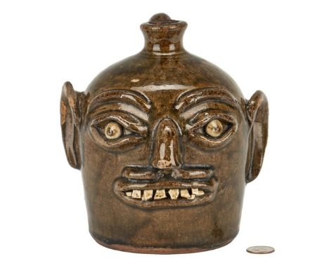 Harvey Ford Reinhardt (Vale, Lincoln County, North Carolina, 1912-1960) alkaline glazed folk art pottery face jug, stamped "H