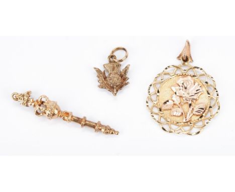 1st item: Ladies 9K yellow gold scepter pendant. The pendant is marked "375" and is 1 3/4" H. The gross weight of the pendant