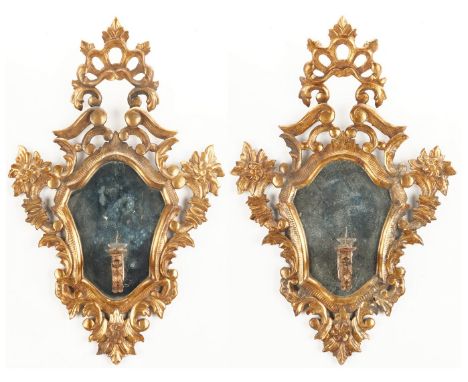 Pair of Italian Florentine style gilt carved candle sconces, comprised of shell and pierced crests above a central shaped mir