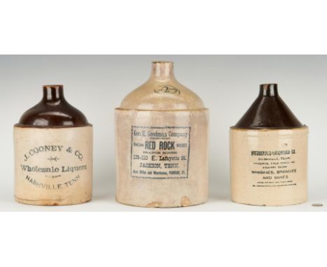 Three (3) Tennessee Whiskey Advertising Stoneware Jugs. 1st item: Jackson, TN 2-gallon whiskey jug with cobalt stenciled lett