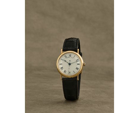 Breguet. Montre bracelet en or jaune 18K (750) avec date et seconde au centre mouvement automatiqueBreguet. An 18K gold autom